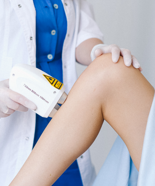 shockwave therapy device on leg